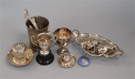 A group of assorted mainly silver items, including a beaker, pierced dish, two small trophy cups and flatware.